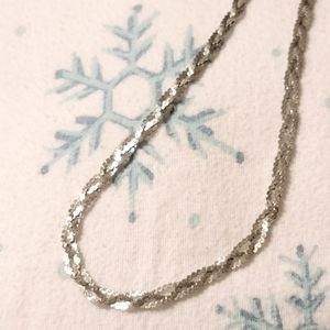 Silver braided necklace.